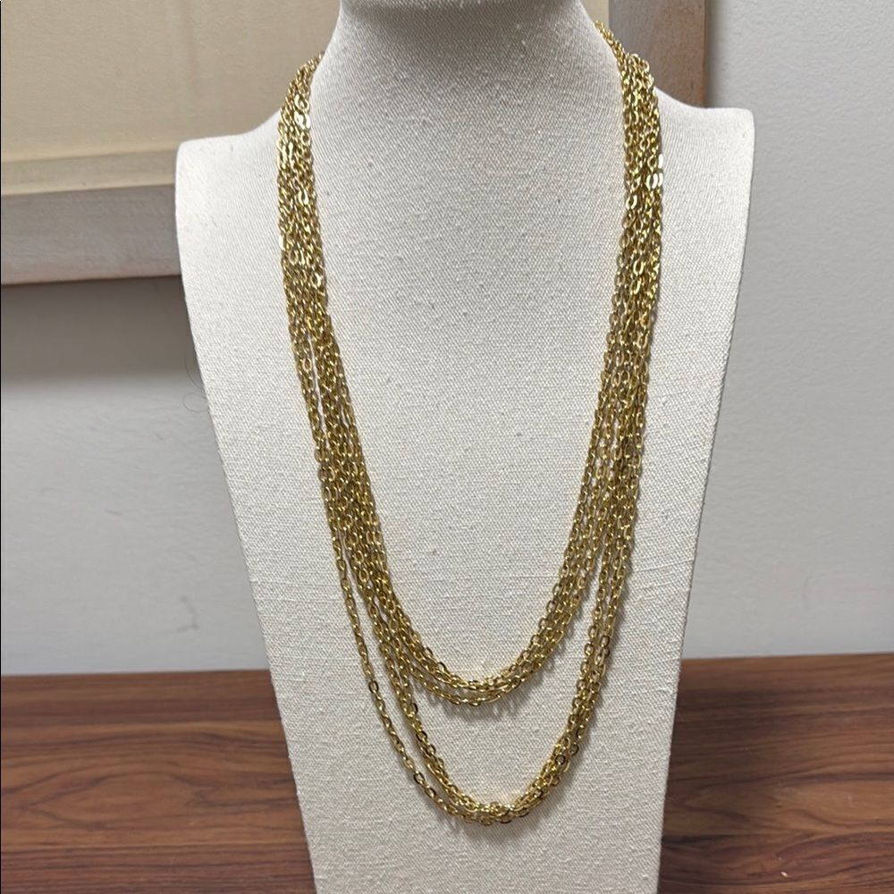 Vintage Gold Tone Oval Link Triple Strand Long Necklace with Spring Ring Clasp.